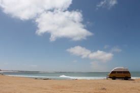 A surfer's van on the beach